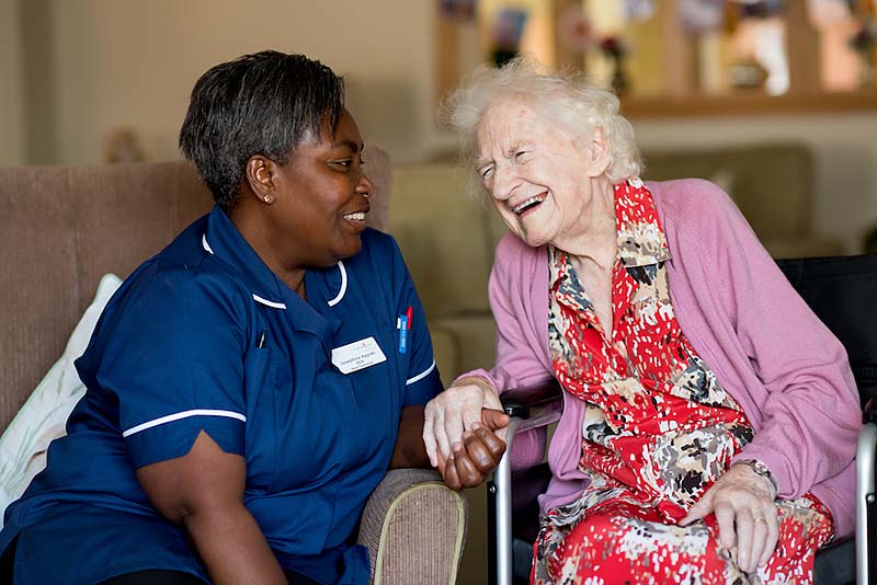 carer chatting with retired lady