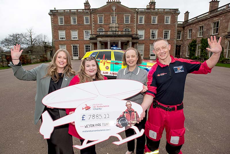 cheque for 8000 pounds handed over by weston park manager