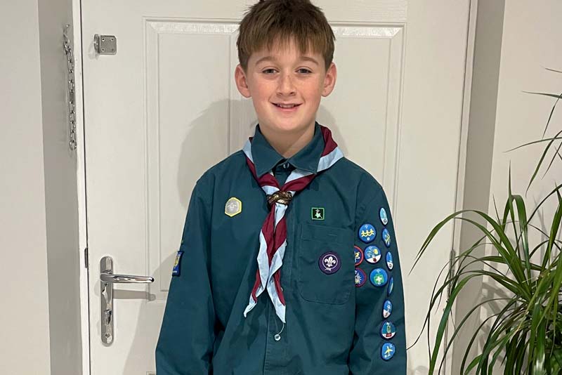 alfie hall wearing his scouts uniform