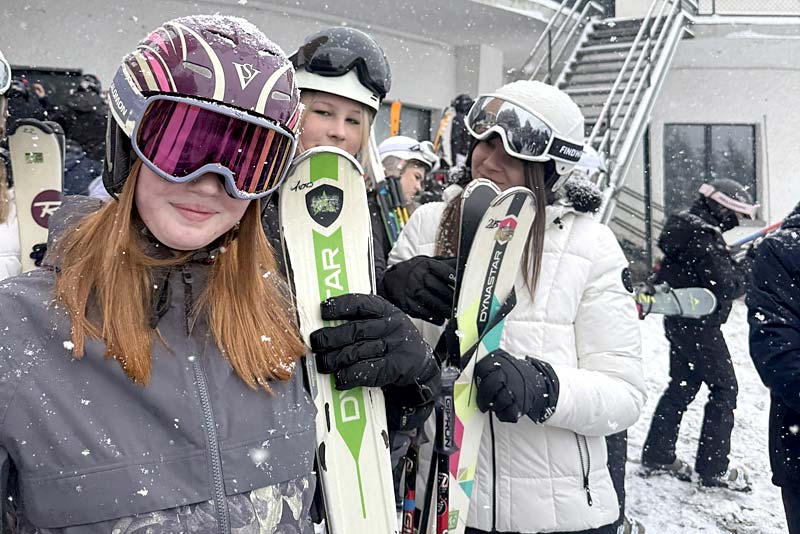 students from newport school waiting for ski lift