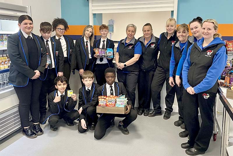 pupils and canteen staff at burton borough school