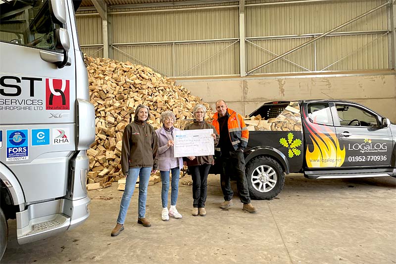 local business owners hand over cheque