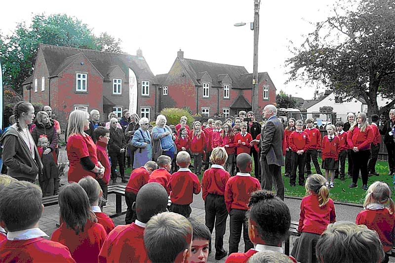 head teacher talks to school pupils