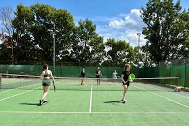 players on the tennis courts at Lilleshall