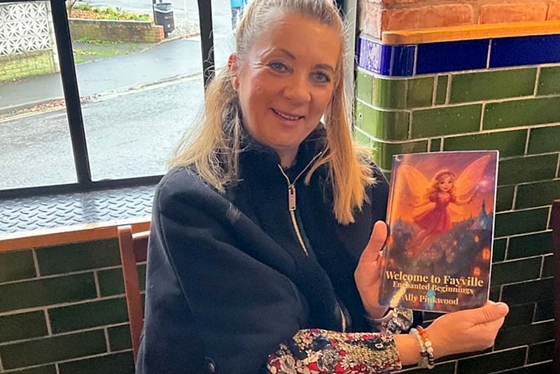 ally pinkwood with her new book