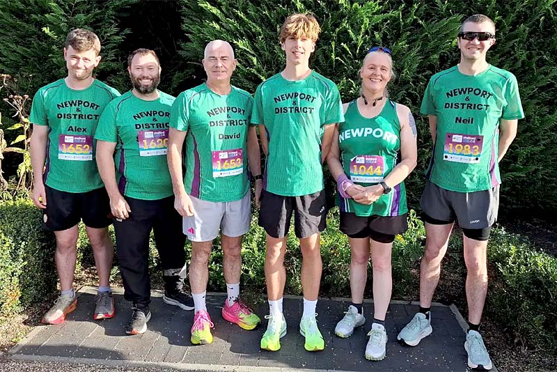 members of newport running club line up before race