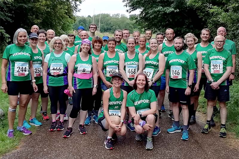 runners stand for group photograph