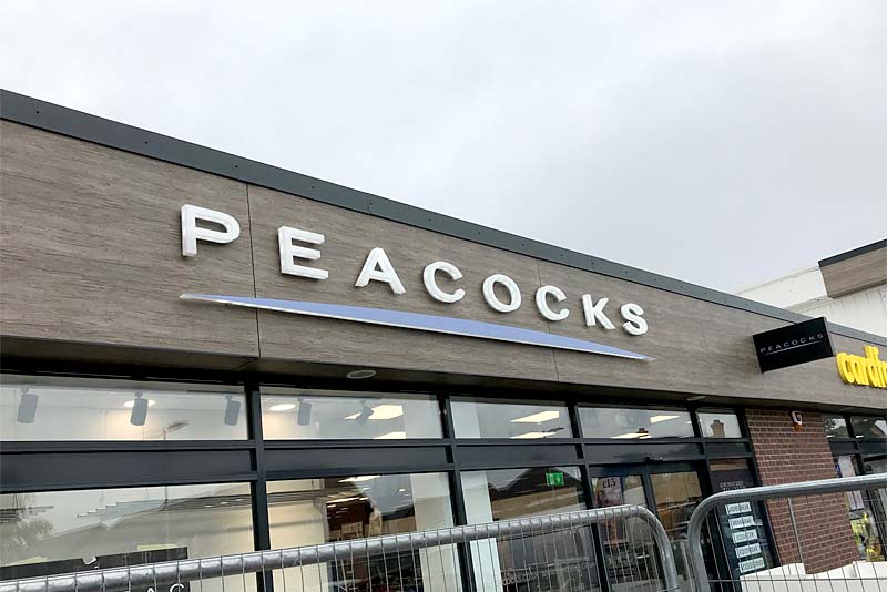 store sign for peacocks in newport