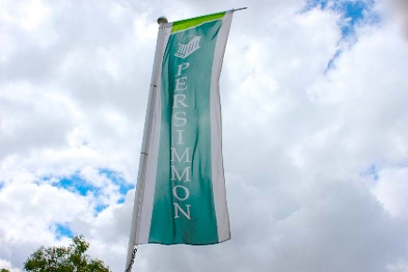 flag with persimmon homes printed on to it