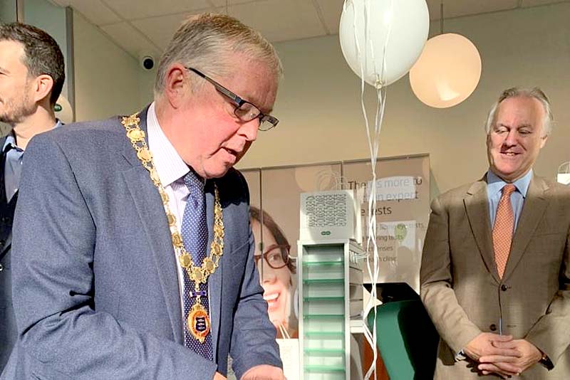 mayor peter scott cutting launch cake
