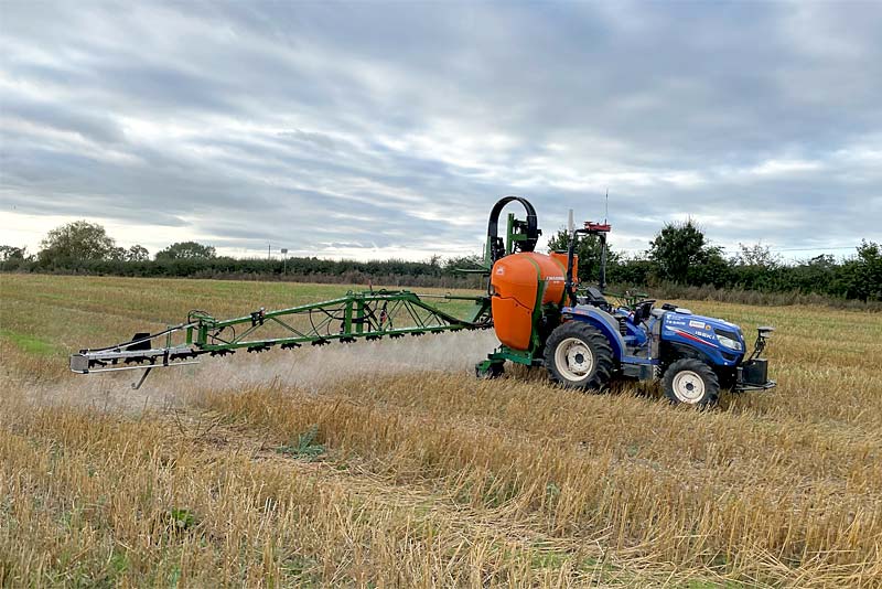 hands free farm tractor sprays field