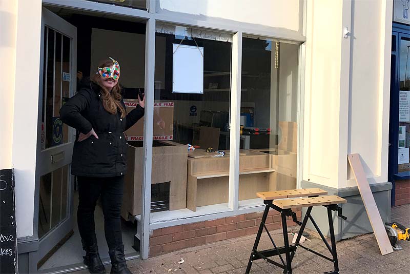 muchies owner standing at shop door